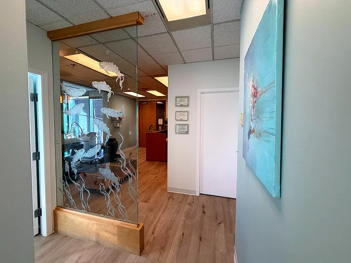 Etched koi glass by the treatment rooms at Pure Light Laser Clinic, Vancouver