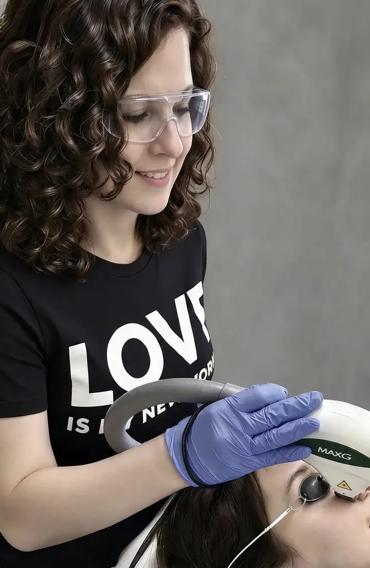 Rita Moldovanos giving an IPL photofacial with the MaxG handpiece at Pure Light Laser in Vancouver