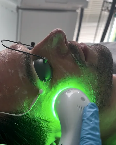 Green LED light therapy during a facial at Pure Light Laser