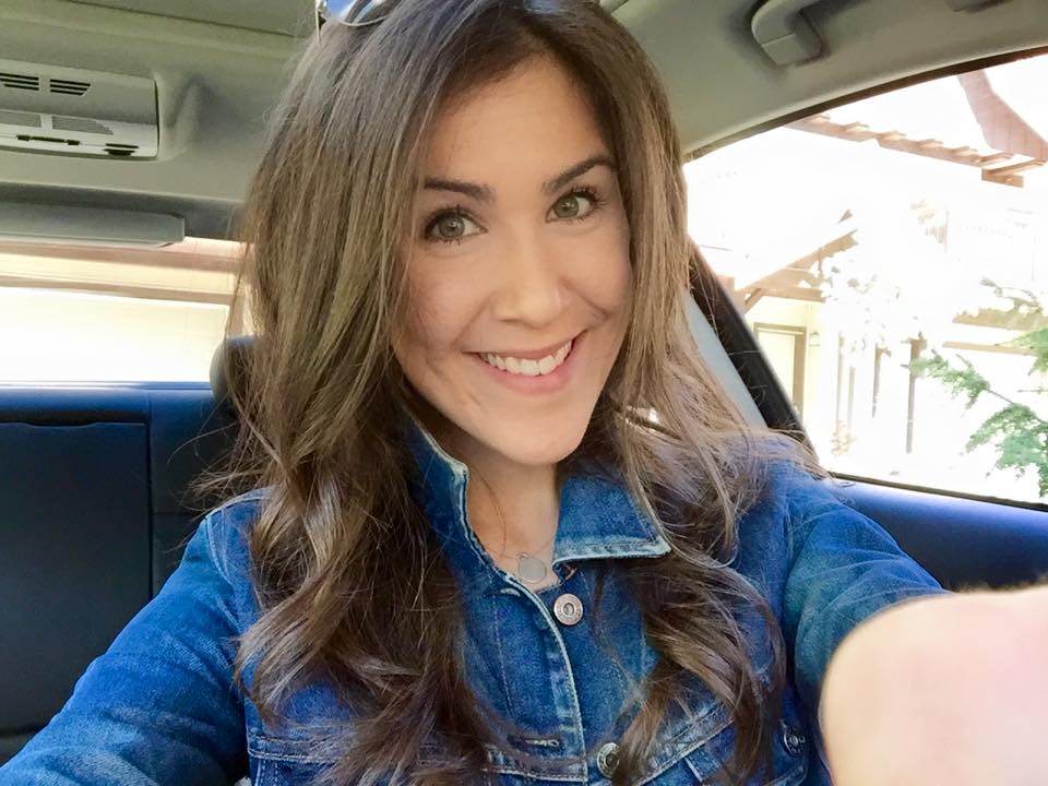Smiling woman with clear skin, from an article on a hidden cause of adult acne